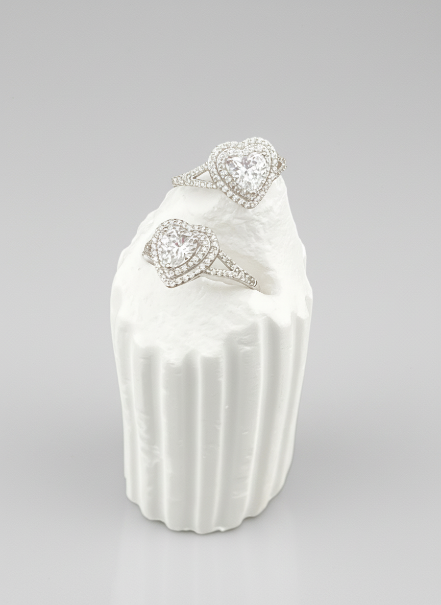 Pearl necklace with heart-shaped clasps on a white background