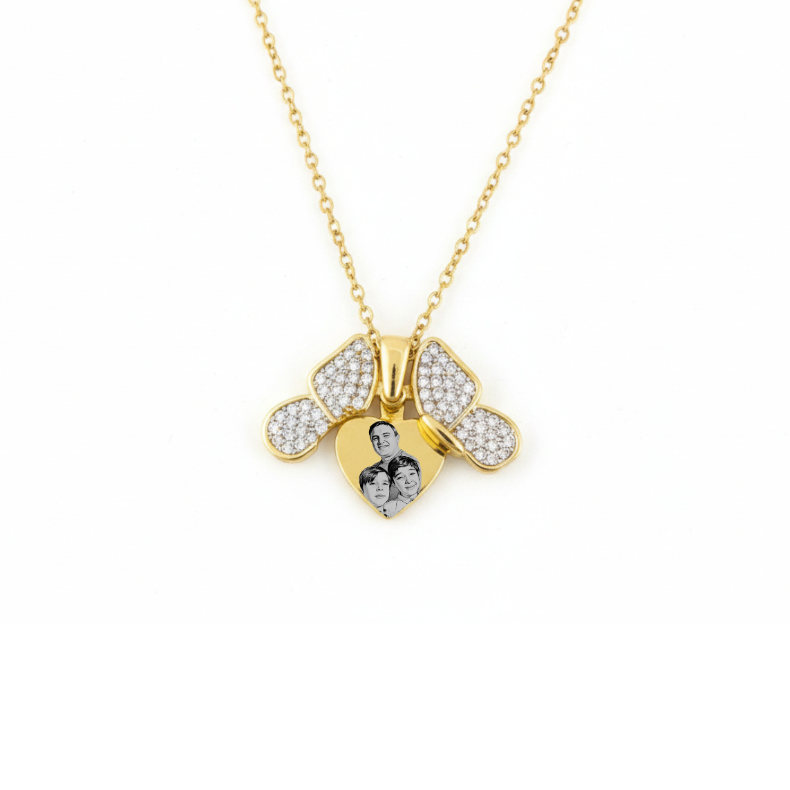 Gold bee-shaped pendant necklace with embedded stones on a white background