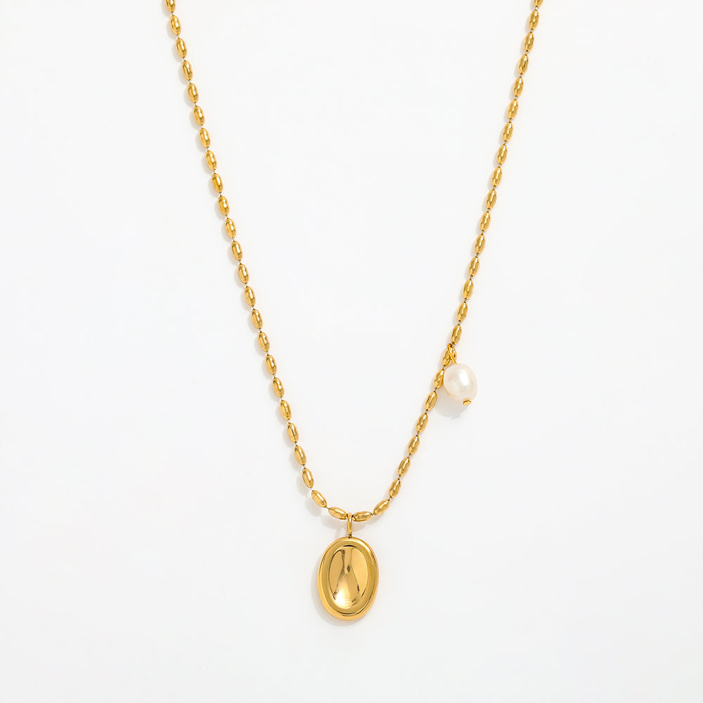 Gold necklace with a pendant on a white background
