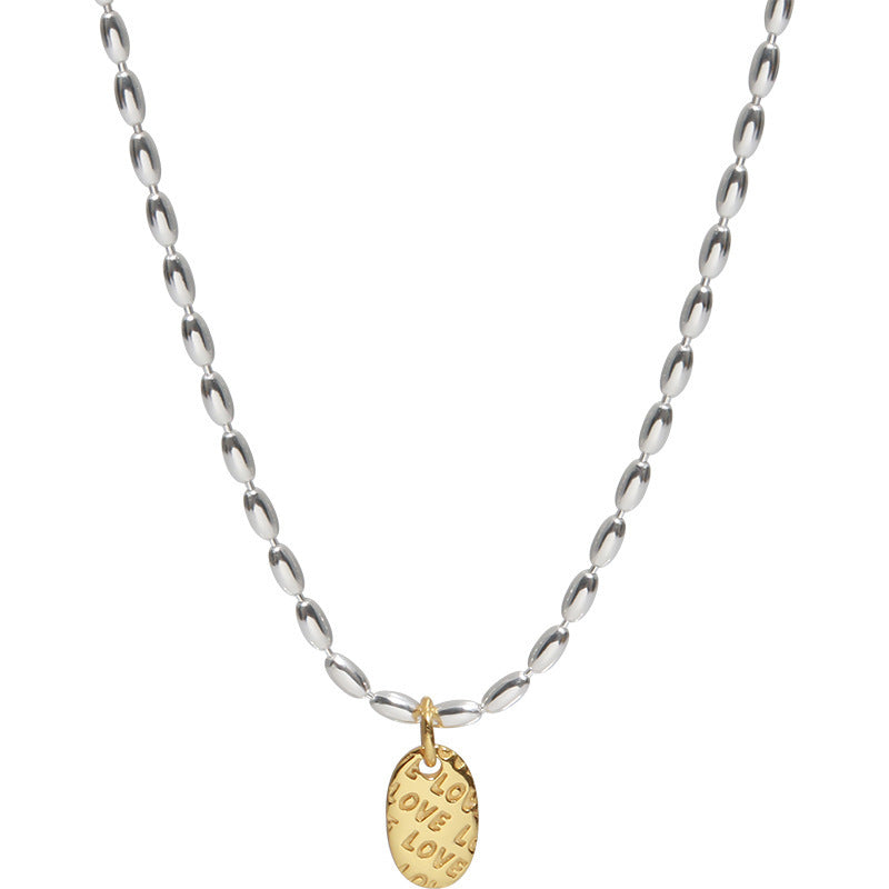 Necklace with a gold pendant on a white background